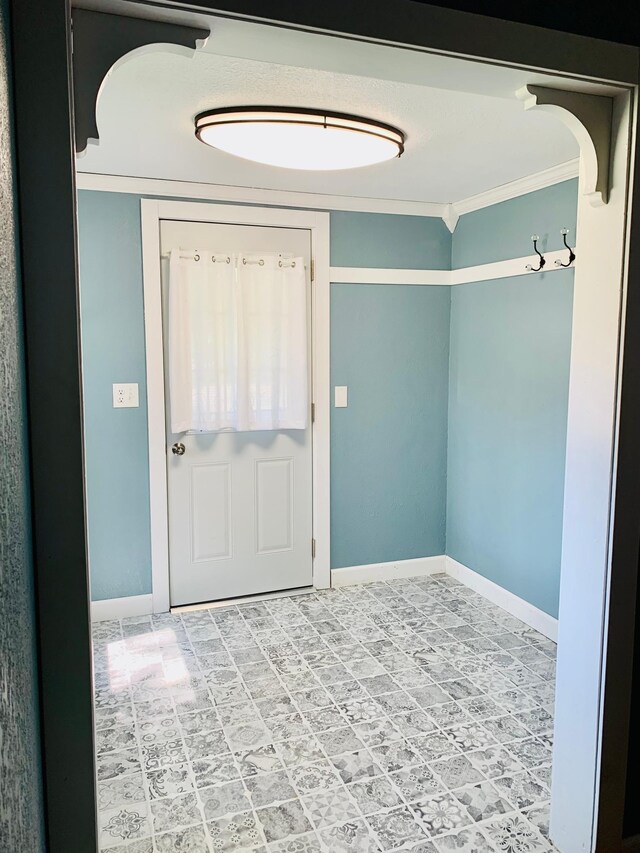 interior space featuring crown molding