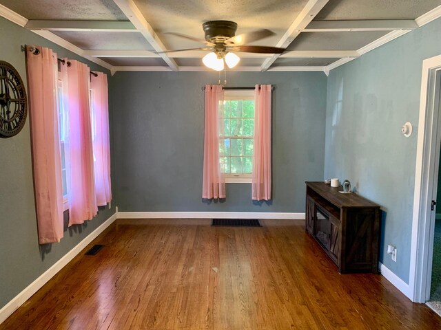 interior space featuring coffered ceiling, ceiling fan, and dark hardwood / wood-style floors