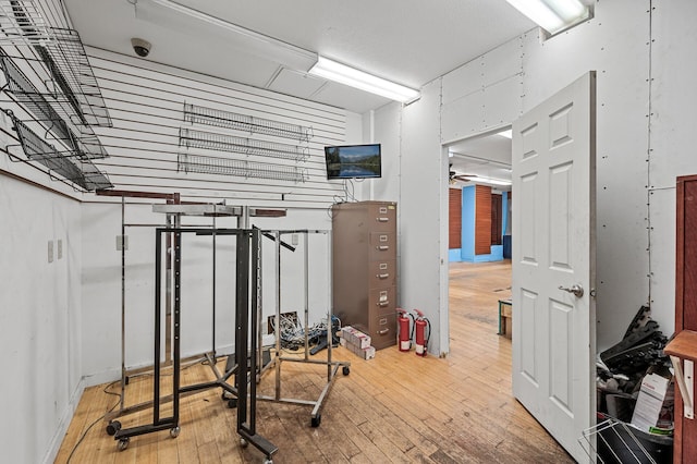 exercise room featuring wood-type flooring