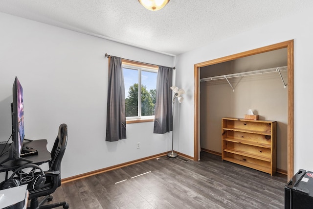 office featuring dark hardwood / wood-style flooring and a textured ceiling