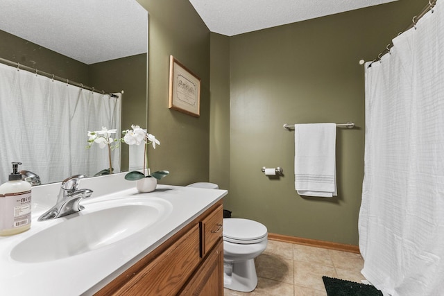 bathroom featuring tile patterned flooring, vanity, toilet, and a textured ceiling