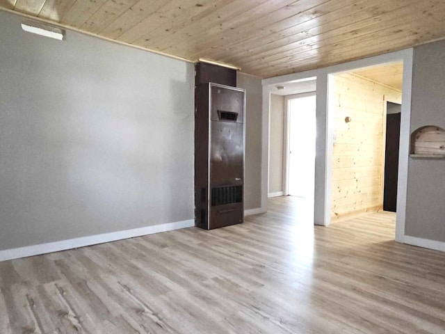 spare room with wooden ceiling and light hardwood / wood-style floors