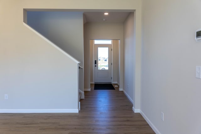 doorway to outside with dark wood-type flooring