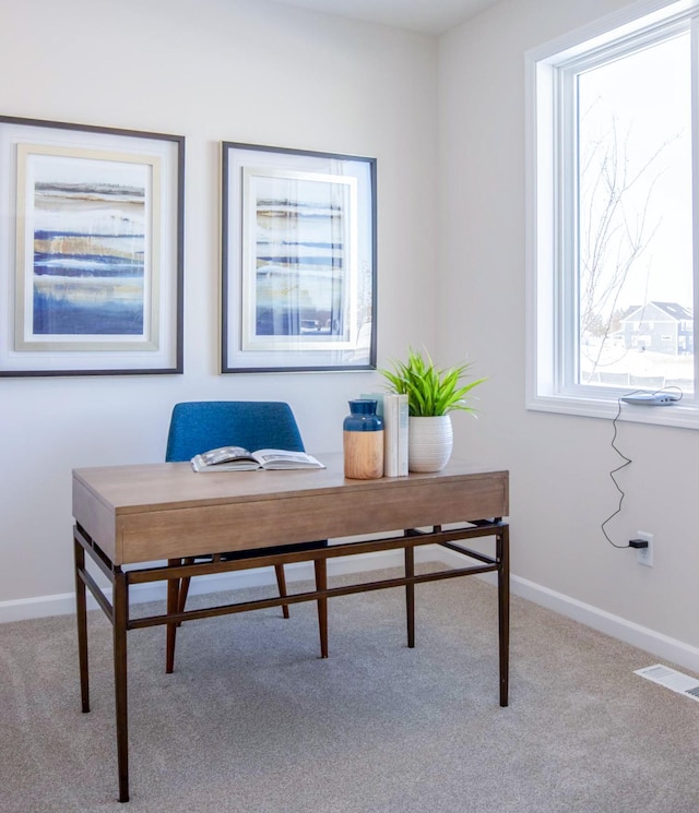 office with visible vents, baseboards, and carpet flooring