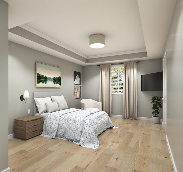 bedroom with a tray ceiling, light hardwood / wood-style floors, and ornamental molding