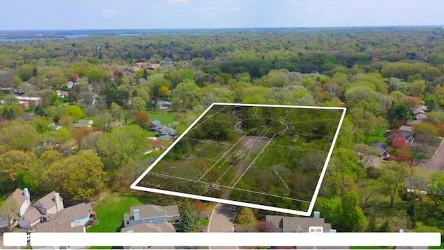 aerial view featuring a view of trees