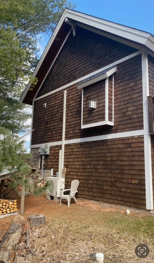 view of side of home with cooling unit