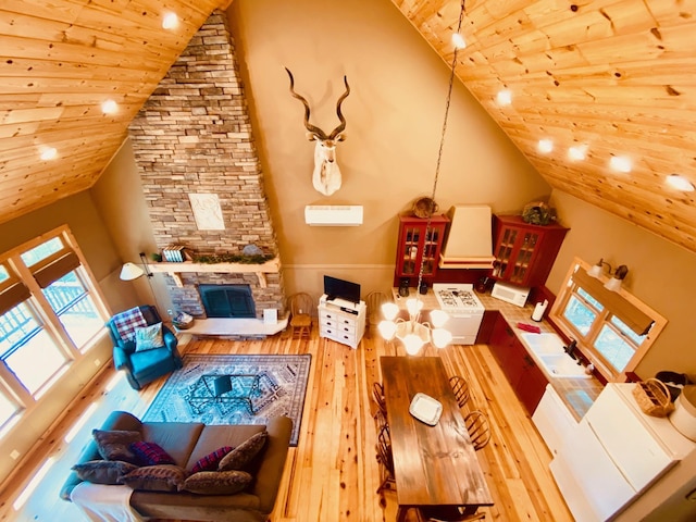 living room with wooden ceiling, high vaulted ceiling, a stone fireplace, and hardwood / wood-style flooring