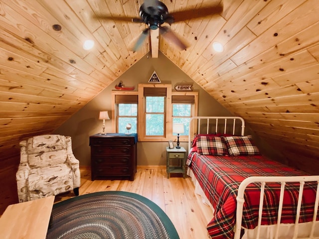 bedroom with light wood-type flooring, lofted ceiling, and wood ceiling