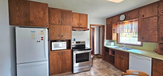 kitchen with sink and white appliances