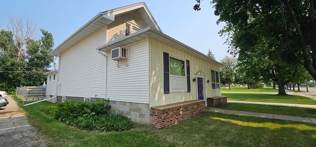 view of side of property with a yard