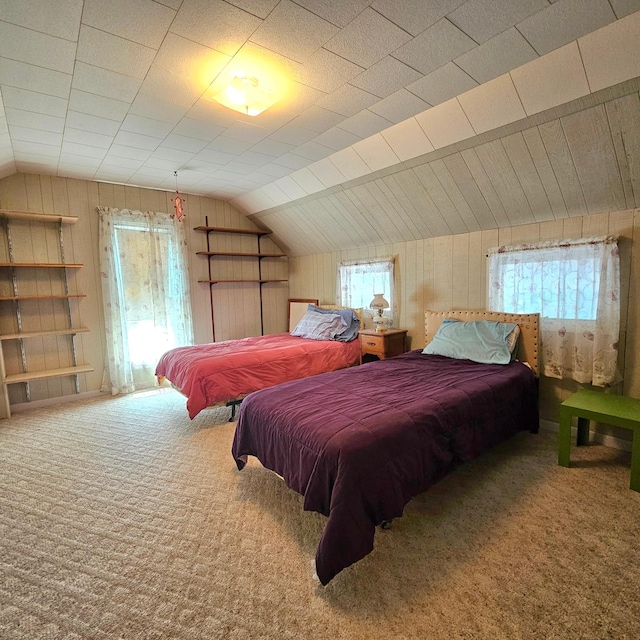 bedroom with carpet, multiple windows, and lofted ceiling