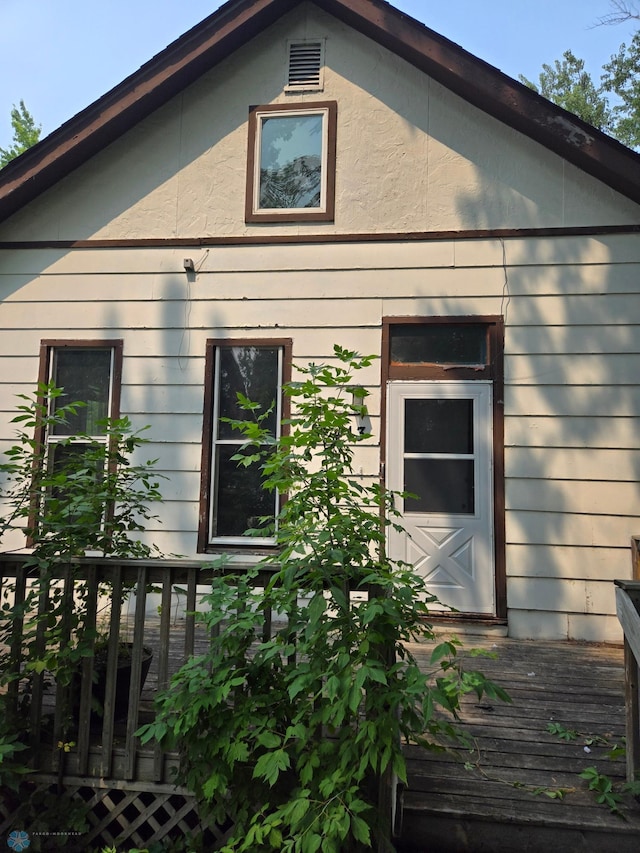 view of property exterior featuring a deck