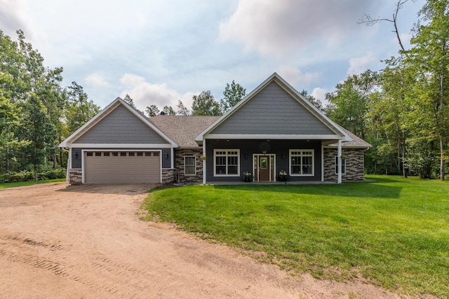 craftsman-style home featuring a garage and a front lawn