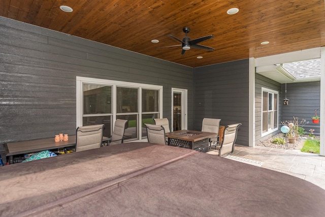 view of patio featuring ceiling fan