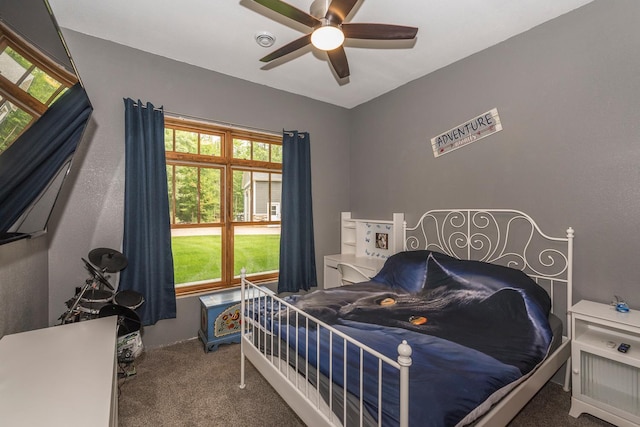 carpeted bedroom with ceiling fan