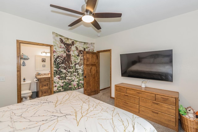 bedroom with ensuite bath, ceiling fan, and carpet