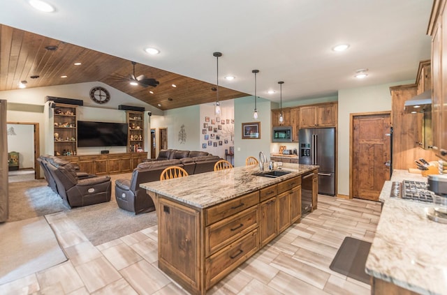 kitchen with decorative light fixtures, a center island with sink, stainless steel appliances, light stone counters, and wooden ceiling