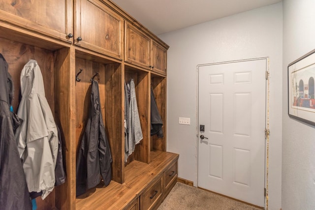 mudroom featuring light colored carpet