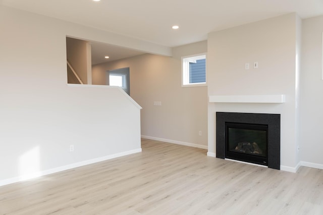 unfurnished living room featuring light hardwood / wood-style flooring