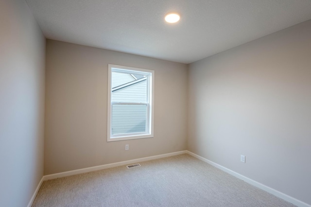 empty room featuring carpet flooring