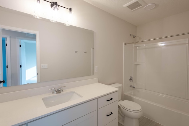 full bathroom featuring vanity, toilet, and tub / shower combination