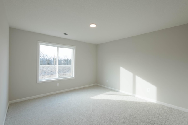 empty room featuring light colored carpet