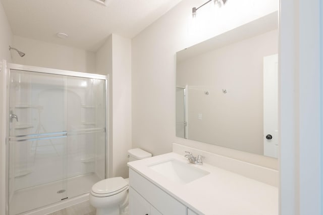 bathroom with toilet, an enclosed shower, a textured ceiling, and vanity