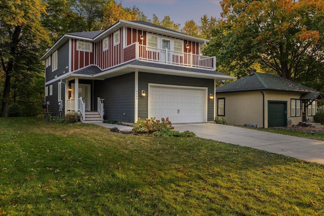 view of front facade featuring a garage and a yard