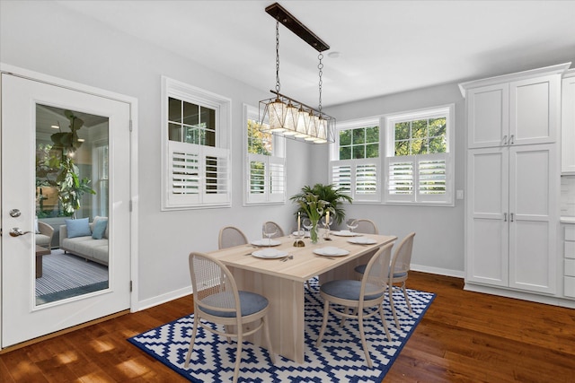 dining area with dark wood-type flooring