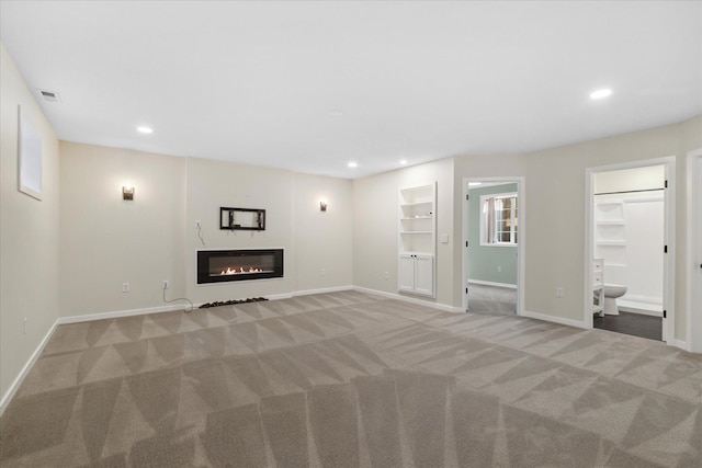 unfurnished living room with light carpet