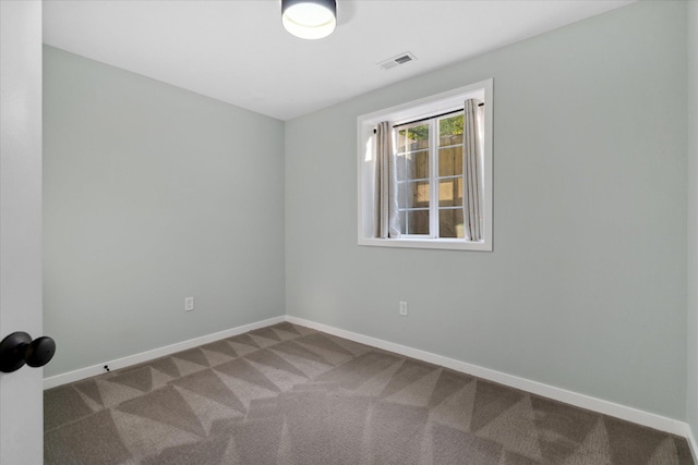 spare room with carpet floors