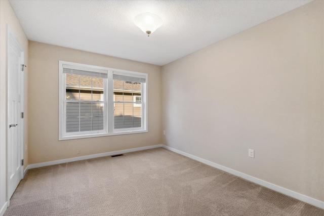 empty room with carpet flooring