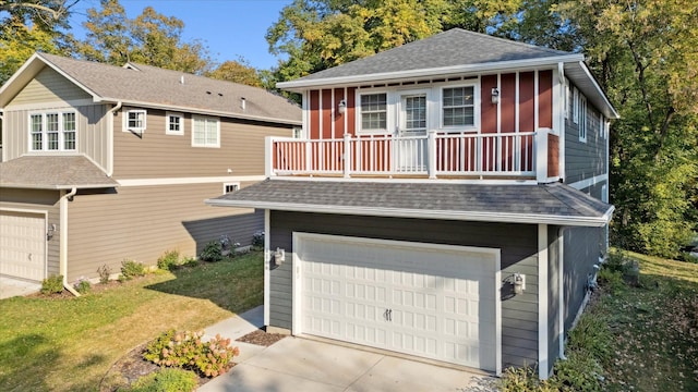 view of front of property with a garage and a front yard