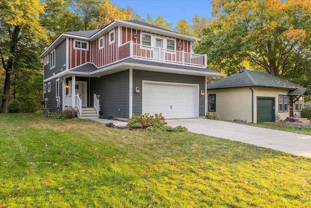 view of front of property with a garage and a front lawn