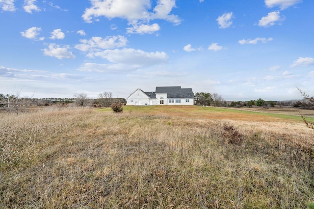 view of yard with a rural view