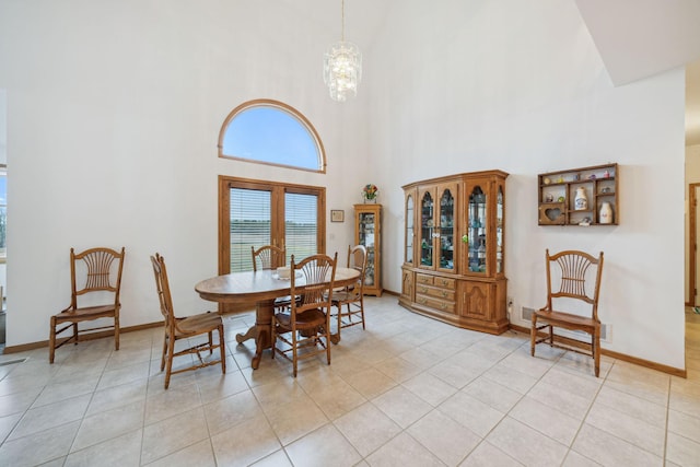 dining room featuring an inviting chandelier and light tile patterned floors