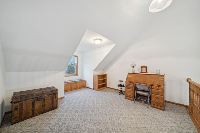 carpeted office with vaulted ceiling