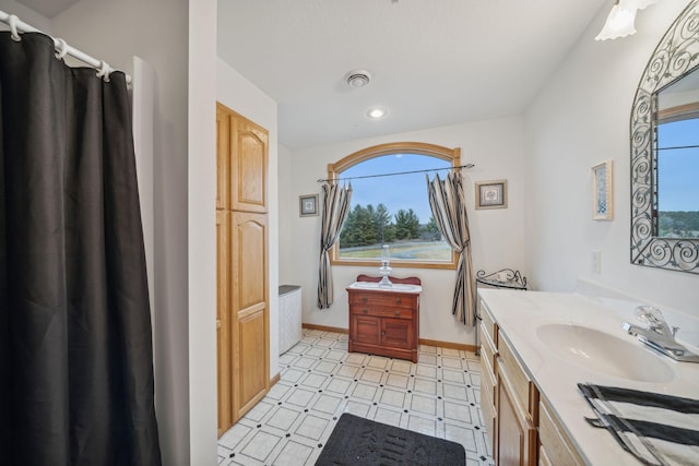 bathroom with vanity and a wealth of natural light