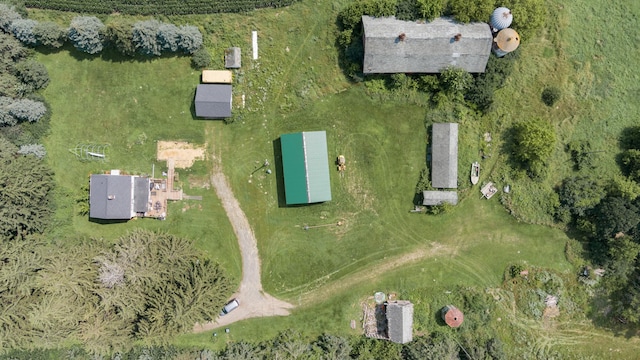 birds eye view of property with a rural view