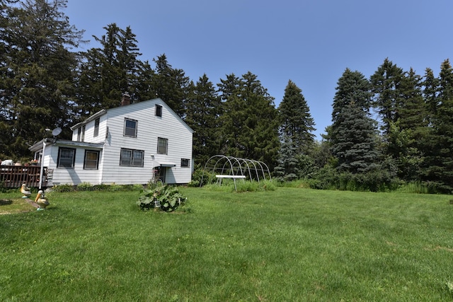 view of side of property featuring a yard