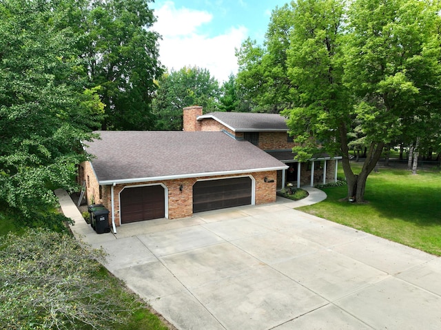 view of front of property featuring a shingled roof, a chimney, an attached garage, a front lawn, and brick siding