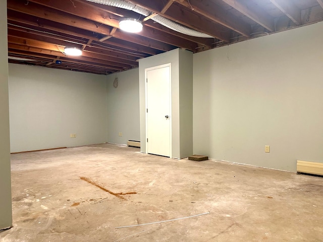 unfinished basement with a baseboard heating unit