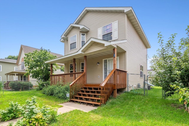 view of front of property featuring covered porch and a front lawn