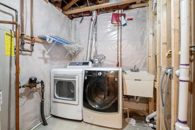 washroom featuring sink and washer and dryer