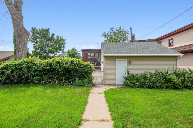 view of outbuilding featuring a lawn