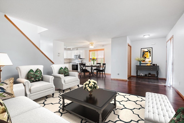 living room with dark hardwood / wood-style floors and ceiling fan