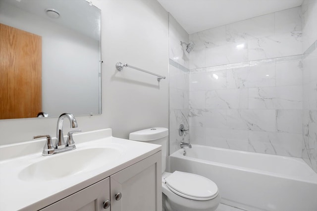 full bathroom featuring vanity, toilet, and tiled shower / bath