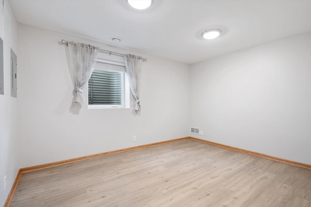 spare room featuring light hardwood / wood-style floors