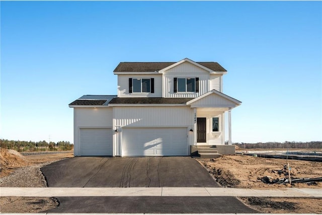 view of front of property with a garage